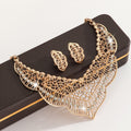 Luxury gold crystal necklace and earrings set displayed on a black jewelry box with sparkling rhinestone details