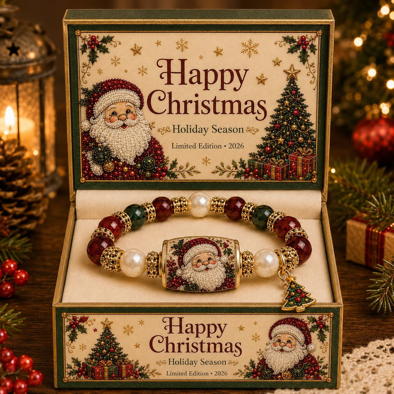 A Christmas-themed beaded bracelet with a Santa Claus face centerpiece, displayed inside an open decorative gift box with 'Happy Christmas' text and holiday illustrations. The box is surrounded by warm holiday decor, including candles, pinecones, ornaments, and soft lights.