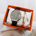 Black celestial moon quartz watch with a gold-tone case, matching crystal bracelet and orange presentation box.