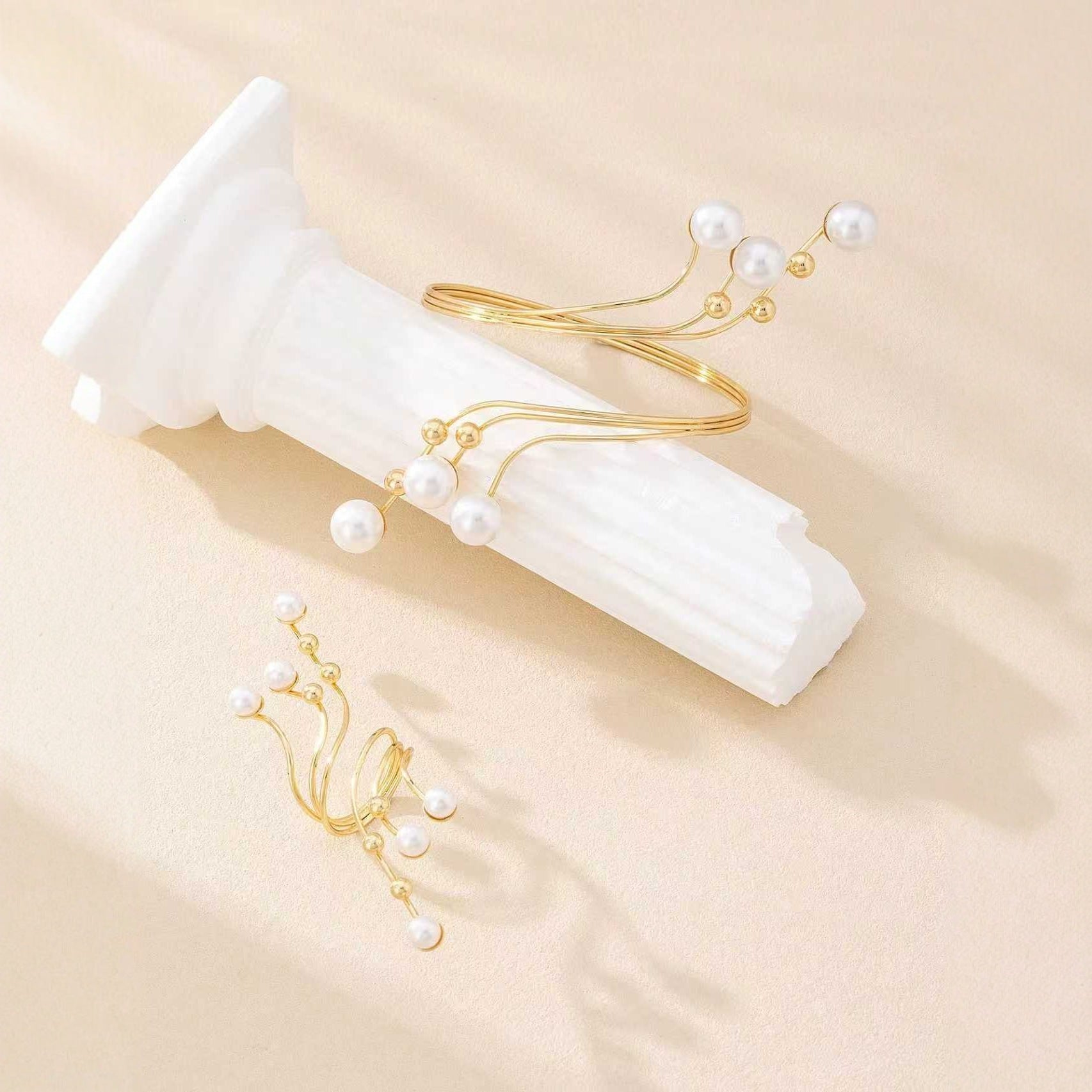 Gold-tone pearl hand chain bracelet and matching statement ring jewelry set for women