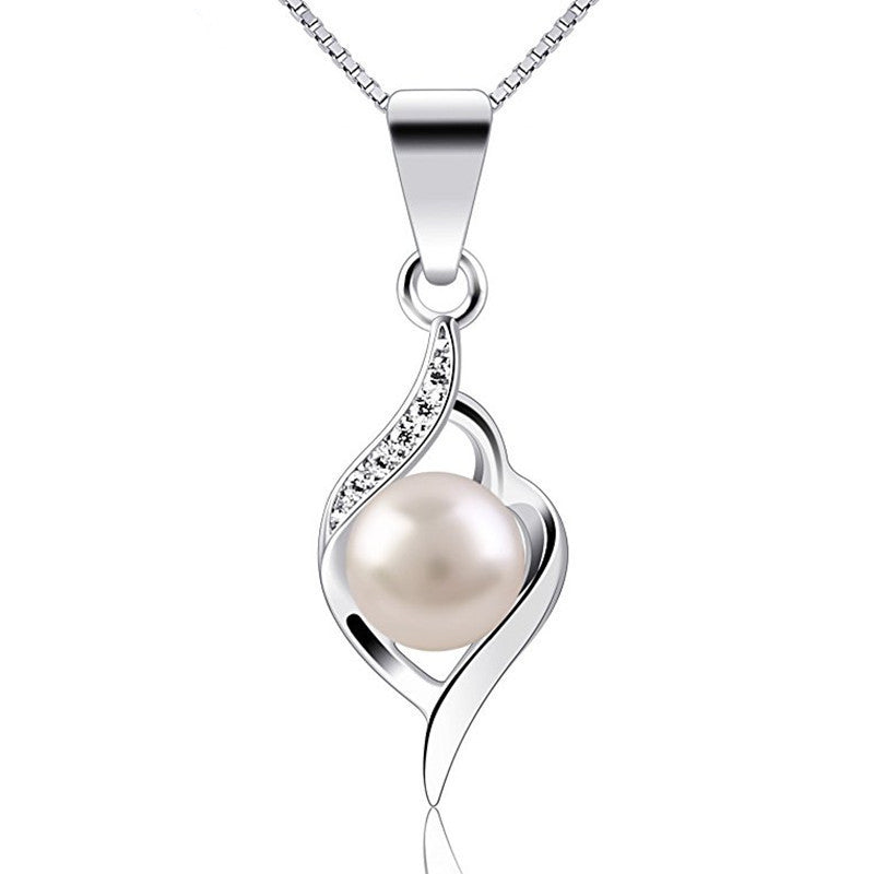 Silver pendant with a pearl on a white background
